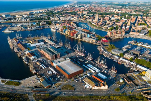 Port of Dunkirk taken from above showing ships, containers and buildings
