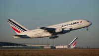 Air France plane taking off from runway left to right