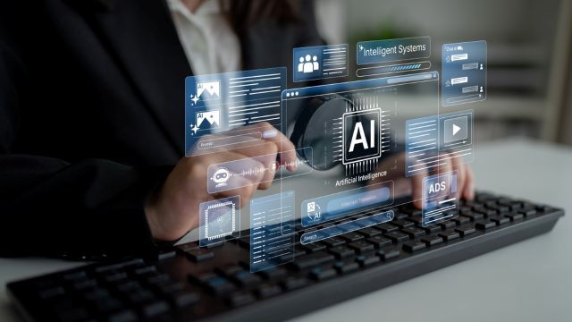 Suited man tapping on keyboard with AI holograph