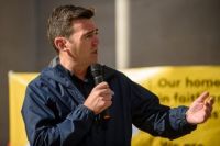 British MP Andy Burnham talking into microphone